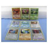 Nine Assorted Pokemon Trading Cards In Sleeve