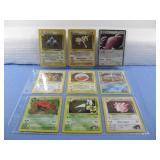 Nine Assorted Pokemon Trading Cards In Sleeve