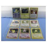 Nine Assorted Pokemon Trading Cards In Sleeve