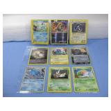 Nine Assorted Pokemon Trading Cards In Sleeve
