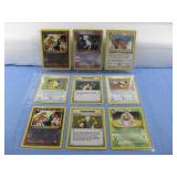 Nine Assorted Pokemon Trading Cards In Sleeve