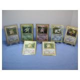 Seven Pokemon Trading Cards In Protectors