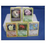 Five Pokemon Cards Including Holographic