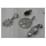 Four Sterling Silver Pendants