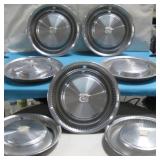 Seven VTG Hubcaps