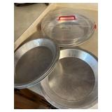 DOZEN PIE PLATES  METAL & GLASS
