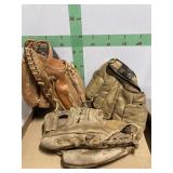 Three Baseball Gloves
