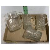4 small glass pitchers