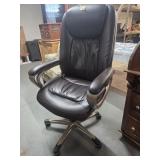 Padded office chair on wheels