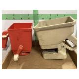 Two Hand-Held Garden Spreaders