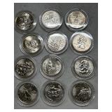 Twelve Misc. State Quarters (in plastic cases)