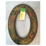 antique oval frame and saw blades