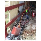 3 push mowers and cans