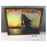 Framed  sailing ship at sunset