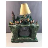 Vintage lamp and fishbowl with gnomes on a