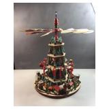 Decorated Christmas pyramid with candle holders