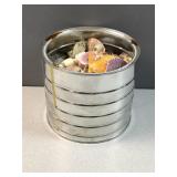 Metal bucket full with sea shells