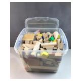 Various shaped Wood blocks in clear tub