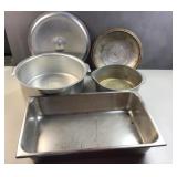 2 metal pots and lids with a serving tub