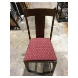 Wooden chair with red cushion