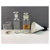 white glass funnel and other science room items