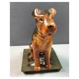 ceramic dog on brass hot plate art
