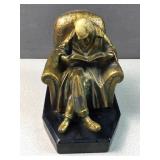 Scholar reading in chair figure library decor