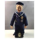 American Sailor figure on stand
