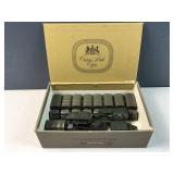 Cigar box of green Army trucks / vehicles