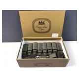 Cigar box of green Army trucks / vehicles