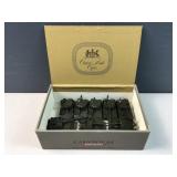 Cigar box of green Army trucks / vehicles