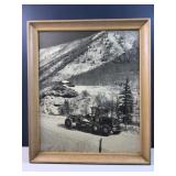 Antique image of road grader in the mountains