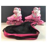 child pink roller skates