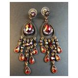 Bronze tone drop earrings with red rhinestones