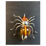 Unmarked amber spider brooch
