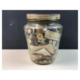 Antique button in antique jar