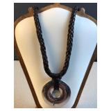 Black leather woven necklace with peace pendant