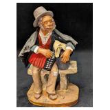 Vintage Old Man Accordion Player Sitting On Bench