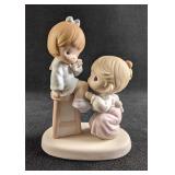 A Precious Moment Porcelain Figurine