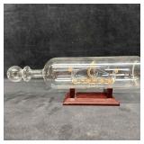 Intricate Art Glass Ship in a Bottle with Wood Sta