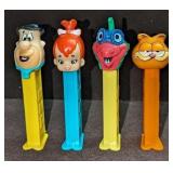 4 Pez Dispensers Garfield Flintstones Dinosaur