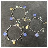 Set of Three Silver Tone Charm Bangle Bracelets wi