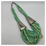 Multi Strand Beaded Necklace with Large Metal Cone