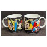 2 Disney Ceramic Strip Mugs With The Original Boxe