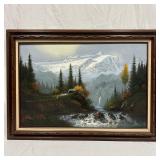 House on a Cliff by the River with Mountain Landsc