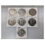 (7) Mixed Date Ike $1 Dollars