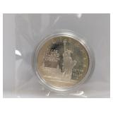 1986 90% Silv Ellis Isl Comm $1 Dollar