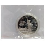 1986 90% Silv Ellis Isl Comm $1 Dollar