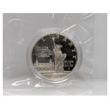 1986 90% Silv Ellis Isl Comm $1 Dollar