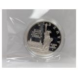 1986 90% Silv Ellis Isl Comm $1 Dollar